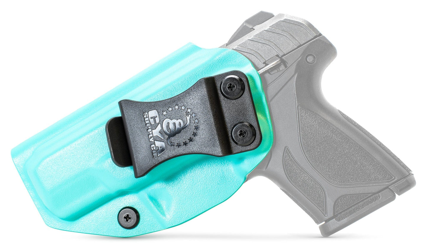 CYA XCarry Holster in teal blue with a black clip on a black Ruger Security 380 handgun