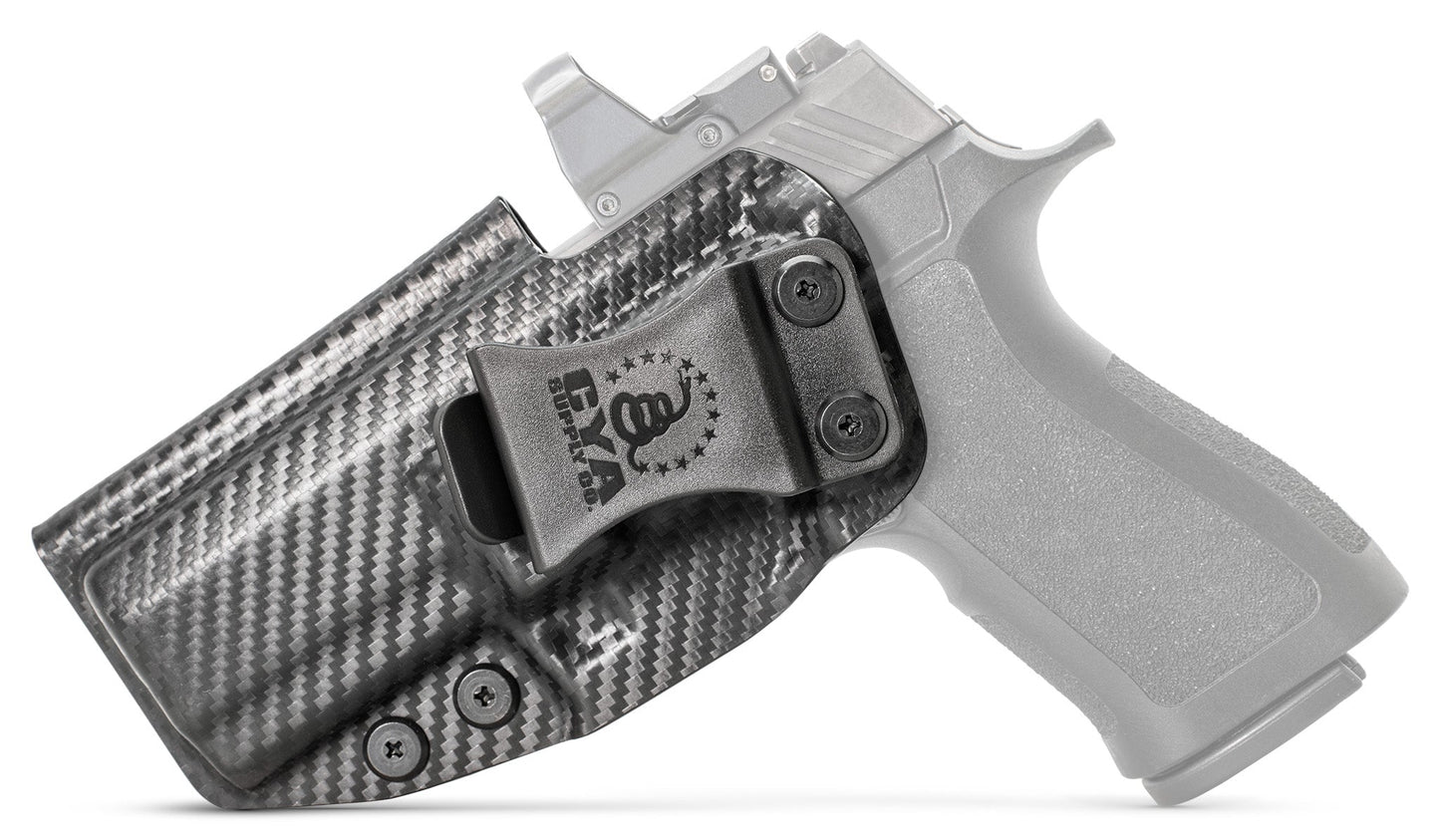 CYA XCarry Holster in carbon steel with a black clip on a black Sig Sauer P320
