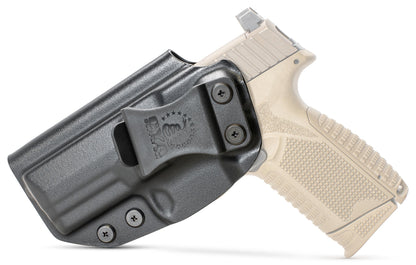 CYA black full size base iwb holster with a black belt clip on a tan fn 509 handgun